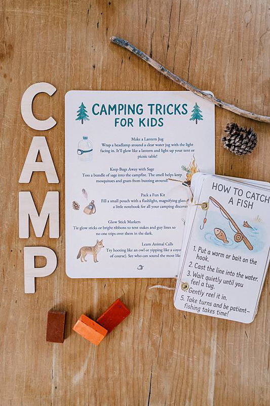 Image of a card with wooden letters spelling c.a.m.p.