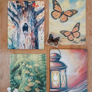 Four cards on a wooden table