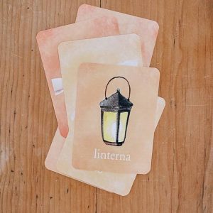 Cards with lantern illustration on a table